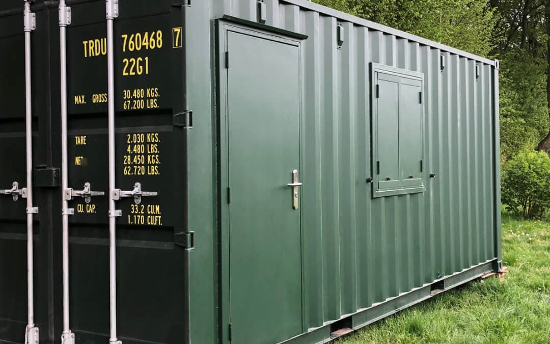 Converted shipping container with door and window