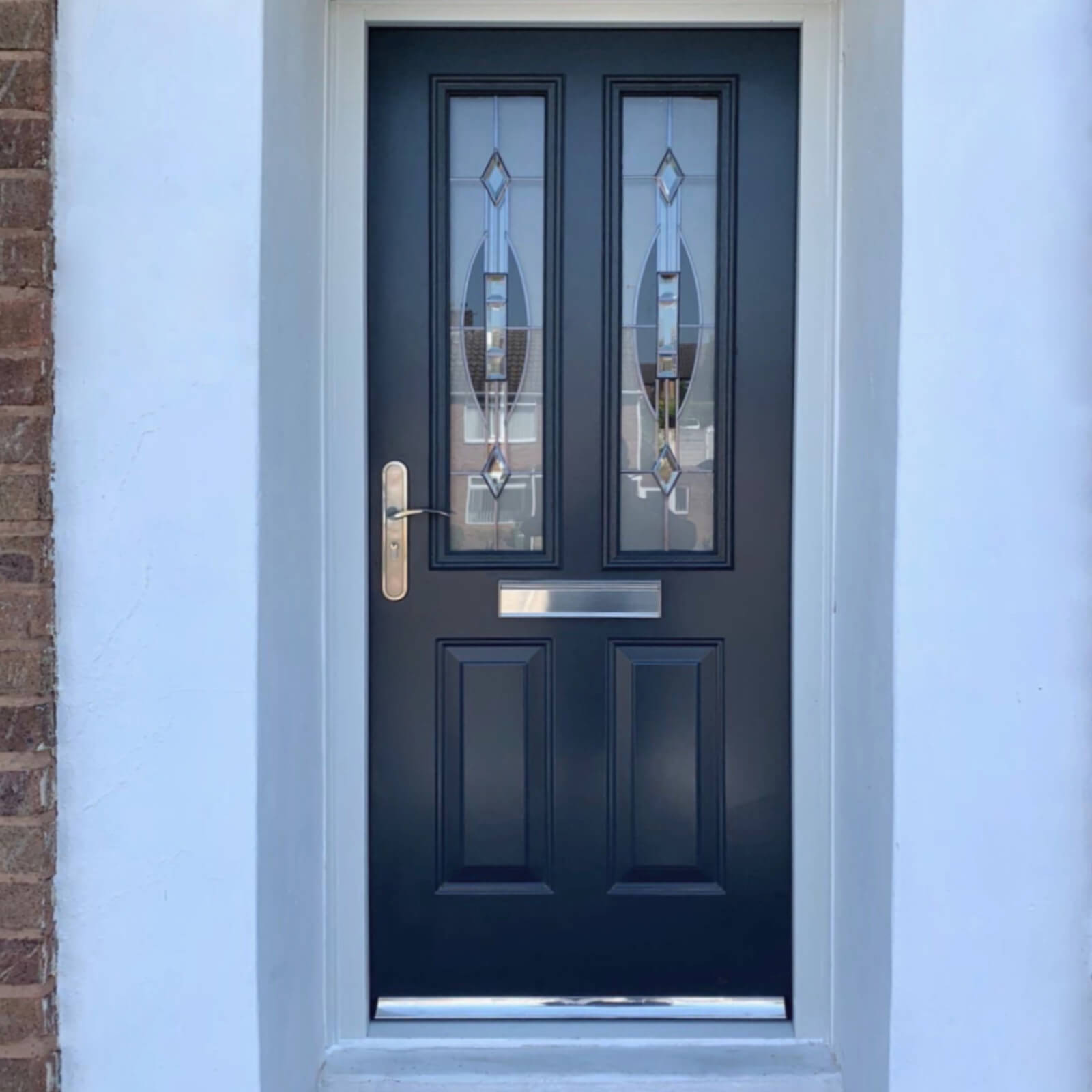 Anthracite grey traditional front door with patterned glass