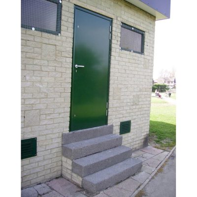 External view of a green steel door installed into a building