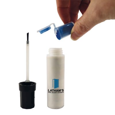 touch up pen with a pot of blue powder being poured in