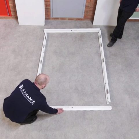 double door frame pieces laid out on the floor