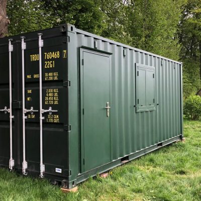 Shipping container with door and window shutter fitted