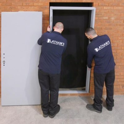 Shot of a door frame being installed into an opening