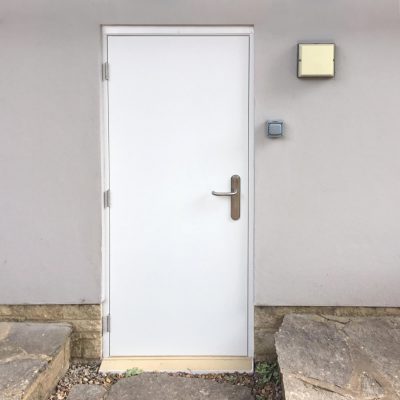 White Budget Door in Grey Wall