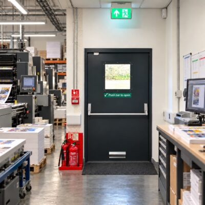 A anthracite grey Custom Made Fire Exit Door with a glazed panel.
