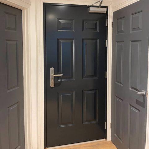 Fire rated panelled front door in anthracite grey