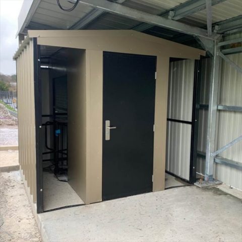 Stadium entrance structure with budget steel door