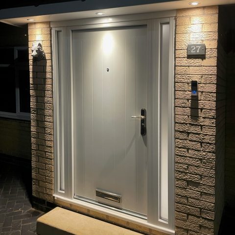Front door in cottage style with door viewer, letterbox and rain deflector