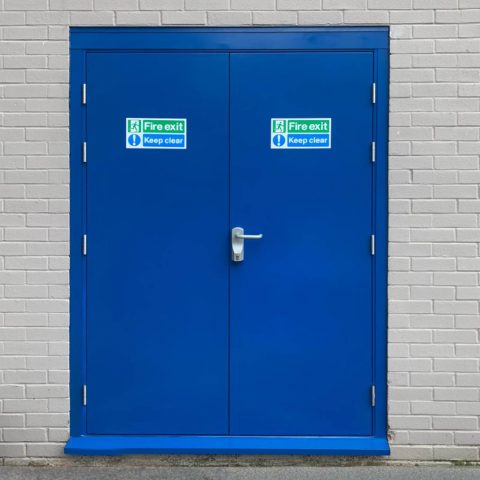 Double fire exit door in blue with Exidor OAD device fitted