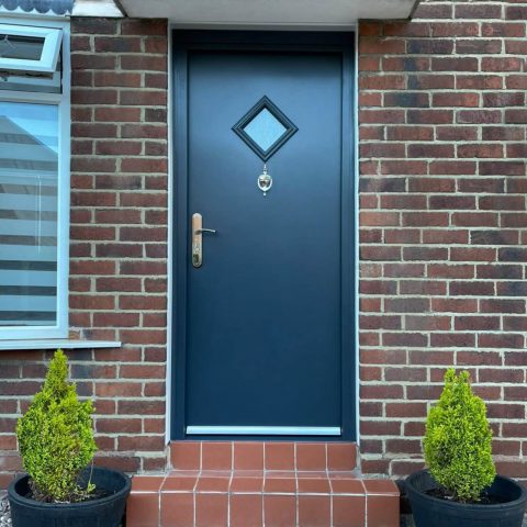 Grey high security front door with diamond vision