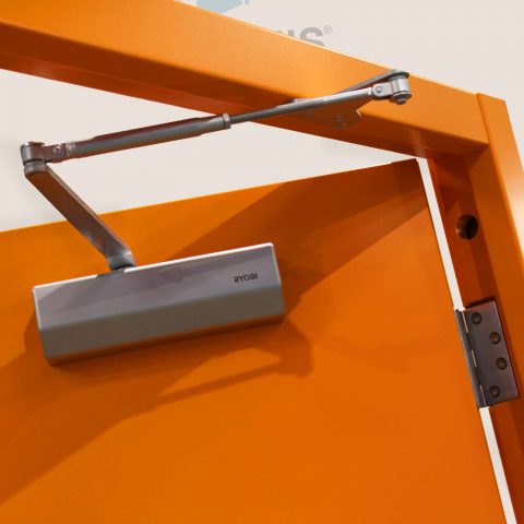 Door closer fitted to orange door