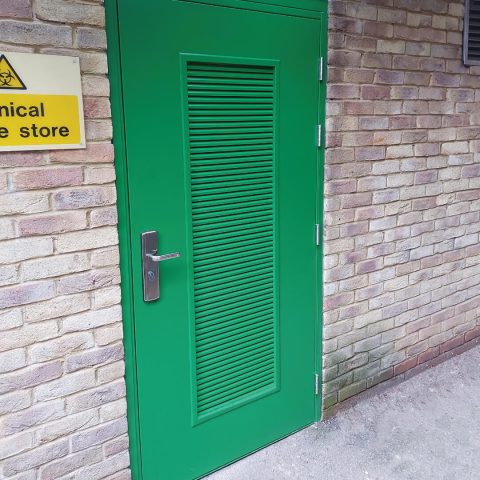Security louvred steel door in green