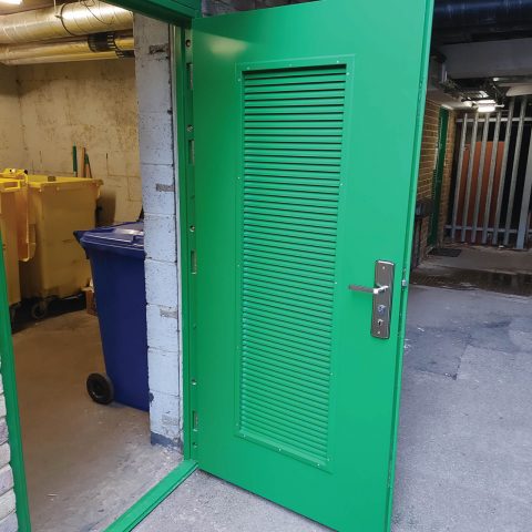 Green louvred security steel door