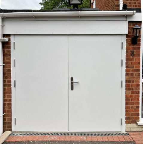 High security side hinged garage door