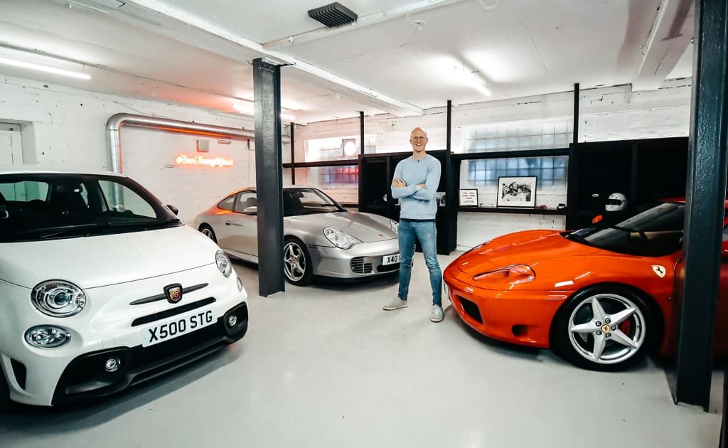 Seen Through Glass - Sam Fane Creator posing with cars