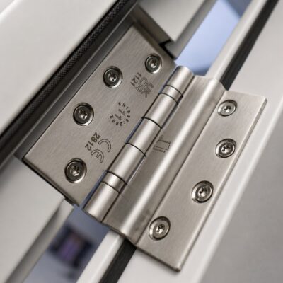A closeup of the ball bearing hinge from a Latham's blank door