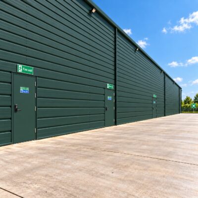 A series of 3 green high security fire exit doors with OAD's