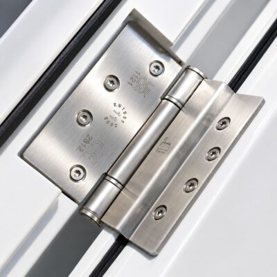 A closeup of a hinge from a high security fire exit door