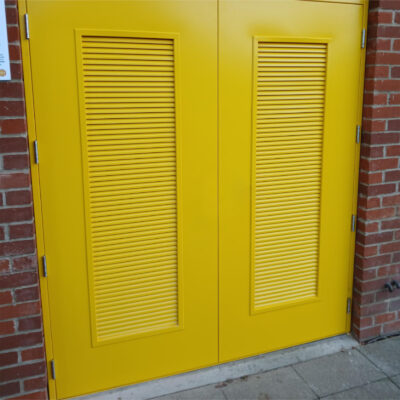 yellow custom made louvred blank double steel door